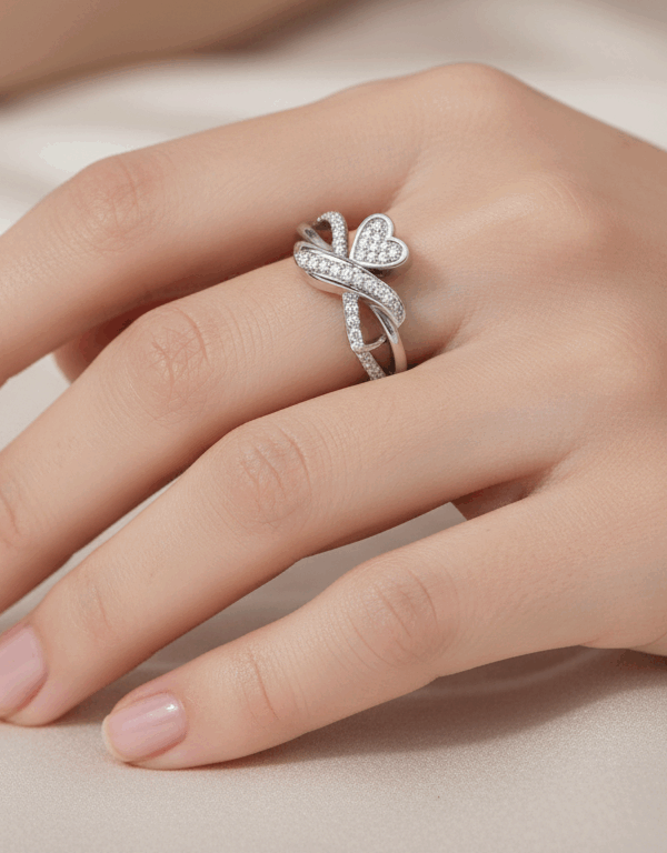 This adjustable butterfly ring is crafted from genuine 925 sterling silver, which is an alloy composed of 92.5% pure silver and 7.5% other metals for added durability. The ring features a delicate butterfly motif with wings that are intricately adorned with shimmering stones, such as Swiss zirconia, to create a brilliant, eye-catching effect. The design is both elegant and versatile, making it suitable for both casual everyday wear and more formal occasions.